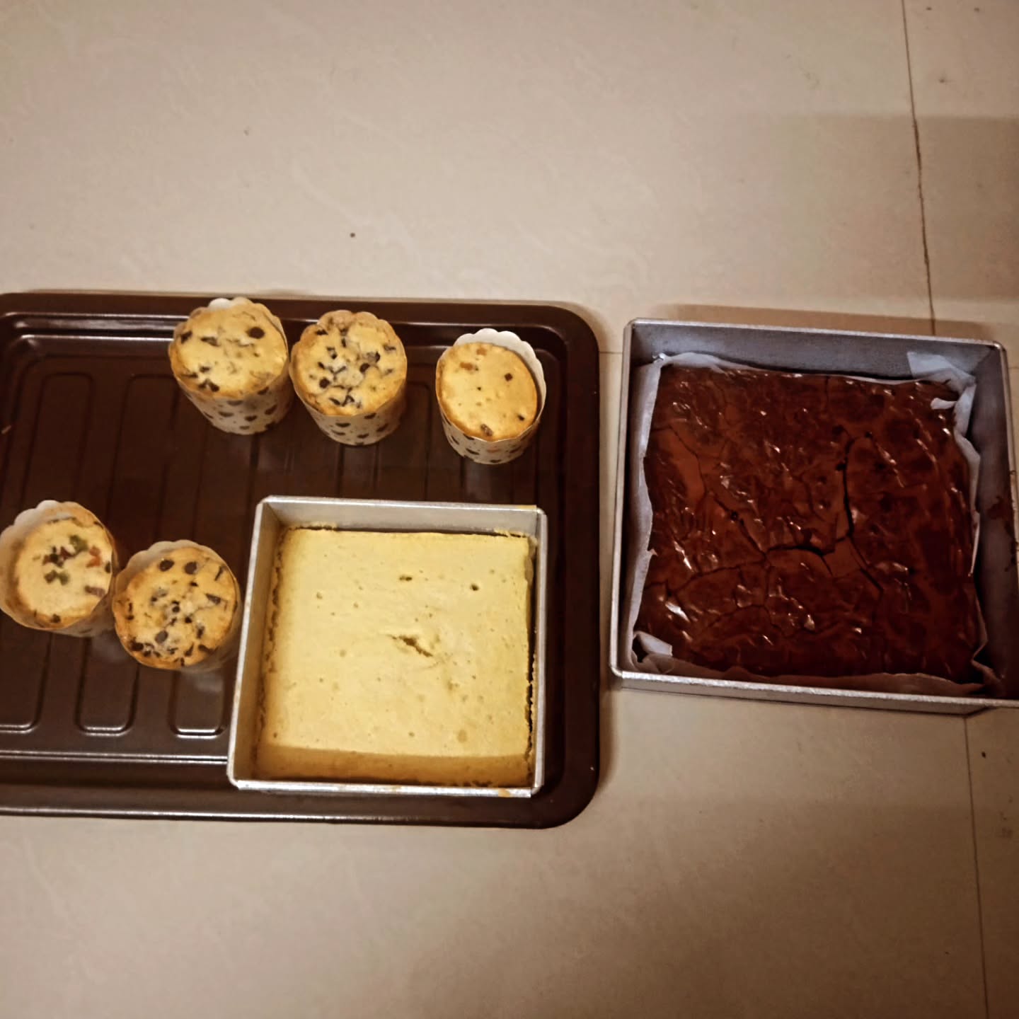 Tea cake, cupcakes and brownie packed together