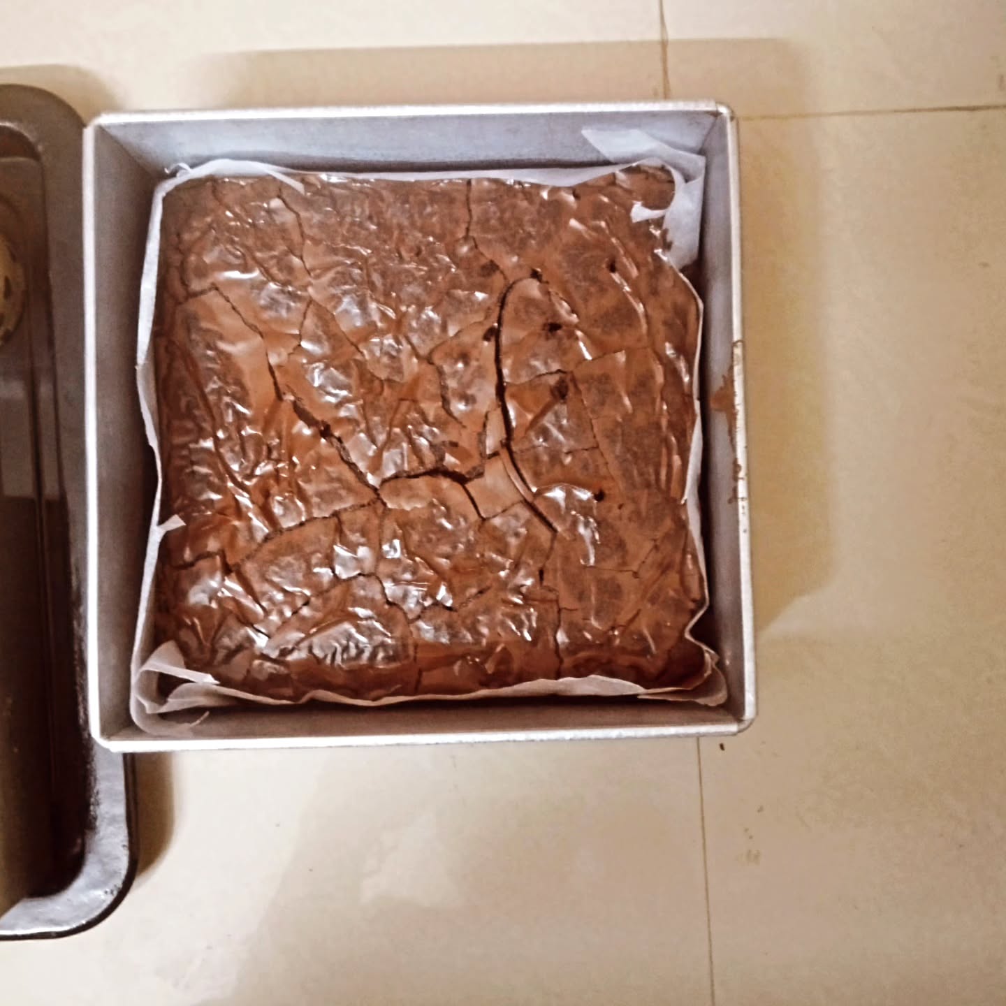 Brownie slab baked in a gift tin